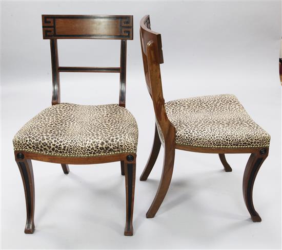 A set of ten Regency style parcel ebonised mahogany dining chairs,